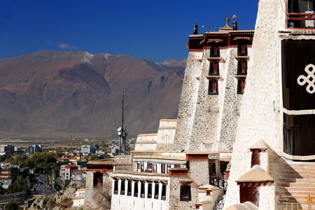 LHASA, TIBET, CHINA - OCTOBER 20: Tibetan workers whitewash the walls in the Potala palace while some locals get to visit the monument on October 20, 2012 in Lhasa-Tibet A.R.-Chinaのeditorial素材
