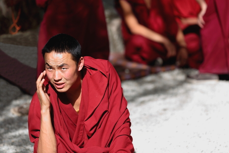 SERA TIBET CHINA  OCTOBER 19: Monks debate on doctrinelearning processbetter comprehension of philosophy on October 19 2012. SeraWild Roses monast.of GelugpaYellow Hat order. Pubuchok mountain slopeLhasa pref.TibetChina.のeditorial素材