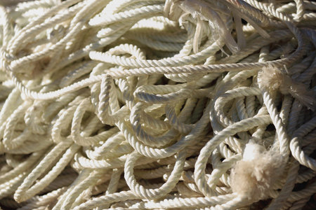White plastic braided ropes for sale on the outside of a shop in a street market in the 3840 ms.high...