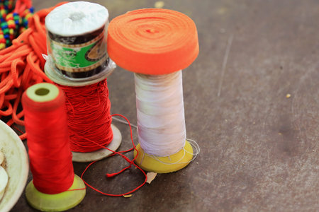 Thread spools exposed for sale in a stall of the street market around the Tashilhunpo-Heap of Glory...