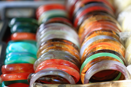 Polished stone bracelets exposed for sale-stall of the street market around the Tashilhunpo-Heap of Glory monastery-seat of Panchen Lama. Shigatse-Yarlung Tsangpo and Nyang Chu rivers junction-Tibet.の写真素材
