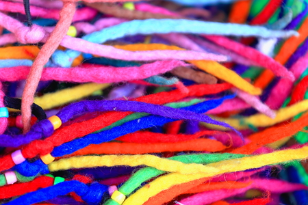 Typical nepalese hand made manycolored felt laces for sale in a souvenir shop of the Thamel area-Kathmandu. Kathmandu district-Bagmati zone-Nepal-Asia.の写真素材