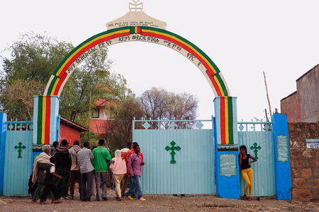 KOMBOLCHA, ETHIOPIA-MARCH 24: Group of devotees enters the church compound to attend religious service in Bete Gebriel-Saint Gabriel christian church on March 24, 2013. Debub Wollo zone-Amhara region.のeditorial素材