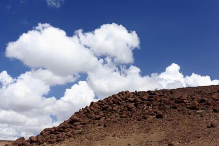 Cumulus clouds over volcanic stones on the Awash river valley seen from the Awash-Asseb Highway between Mile and Semera towns. Administrative zone 1-Afar region-Ethiopia.のeditorial素材