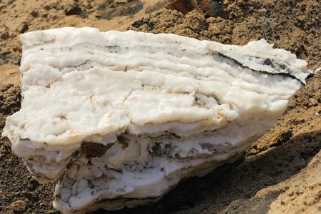 Salt block-artificial pool for water evaporation-salt mounds beside the W.bank on the S.section of the c.100 km2-102 ms.below sea level-160 ms.deep Lake Afrera. Danakil-Adm.zone 2-Afar region-Ethiopiaのeditorial素材