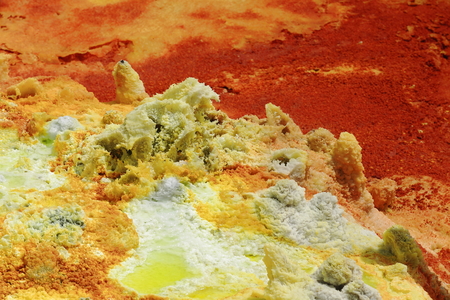 Soil of Dallol mount rising over the surrounding flats of Lake Karum or Assale. Colored deposits of sylvite -KCL- carnallite -KMGCL3.6(H2O)- and kainite -KMG(SO4)CL.3H20. Danakil-Afar region-Ethiopia.のeditorial素材