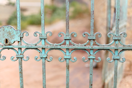 Paint-faded blue iron grate on the outside of the compound of the ethiopian orthdox christian Wukro Chirkos rock-hewn tewahedo-church. Wukro town at 1972 ms.high-Misraqawi zone-Tigray region-Ethiopia.の写真素材