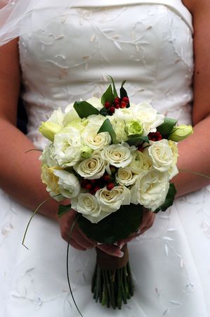 Weddding flowers held at the waistの写真素材