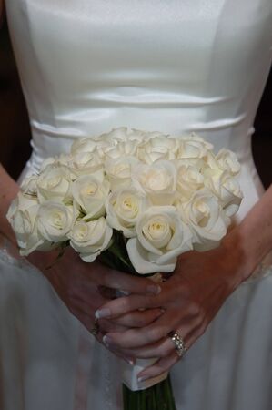 Wedding flowers held waist highの写真素材