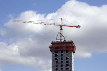 Construction crane on new highrise buildingの写真素材