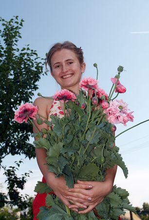 Girl with bunch of flowersの写真素材