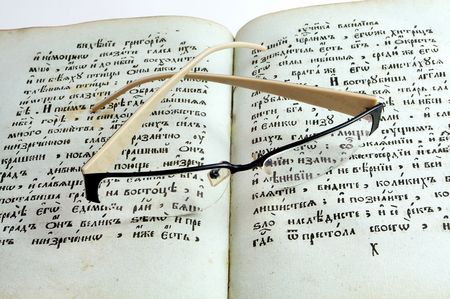 Glasses on antique booksの写真素材