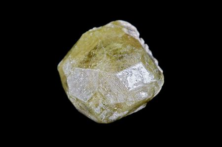 Crystal of garnet grossular on blackの写真素材