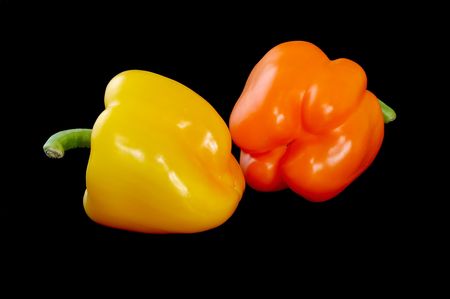 Two sweet peppers on blackの写真素材