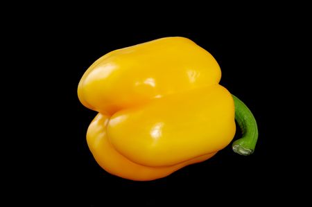 Yellow sweet pepper on blackの写真素材