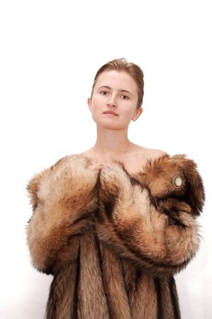 Woman in fur of racoonの写真素材