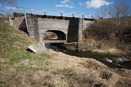 Old wooden bridge in Ferapontovo village, Russiaの写真素材