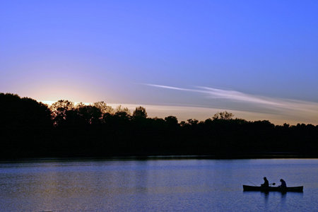 Couple fishing at duskの写真素材
