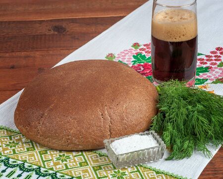 Fresh rye bread on old wooden table.の写真素材