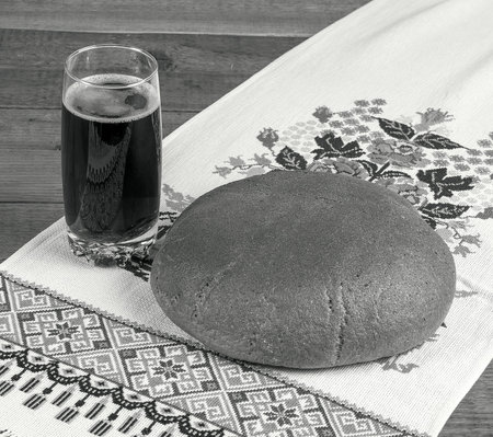 Fresh rye bread on old wooden table.の写真素材