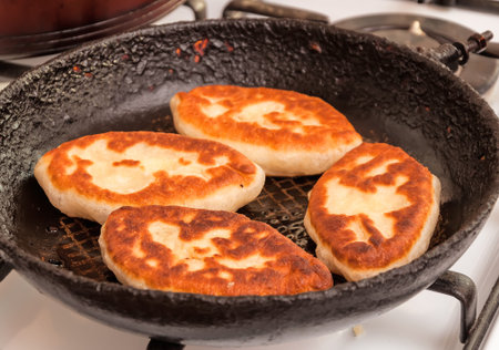 Cooked fried patties in the pan. The patties in the panの写真素材