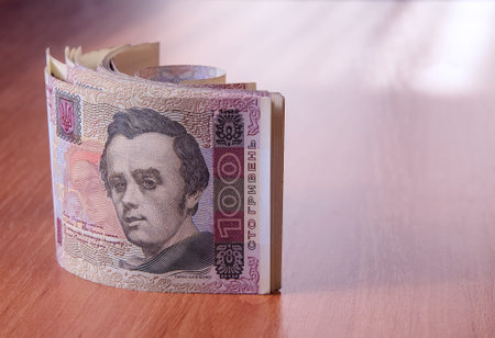 Bank Roll of Ukrainian hryvnia on the table.