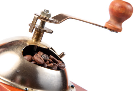 Coffee grinder with coffee beans, isolated on white background.の写真素材