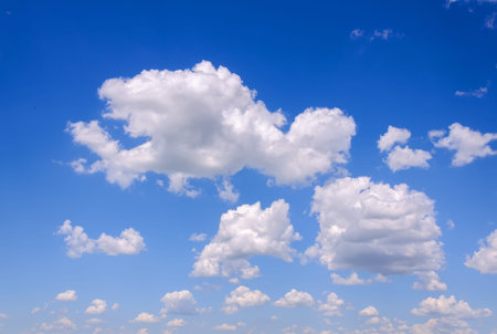 Blue sky background with tiny clouds. Beautiful clouds on blue sky