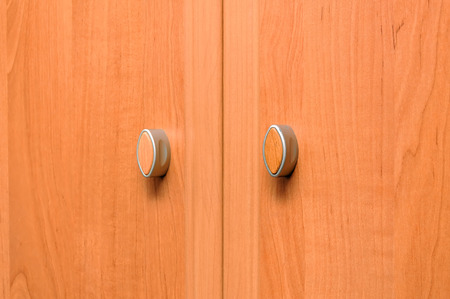 Close-up cupboard wood door, cabinet in kitchen.の写真素材