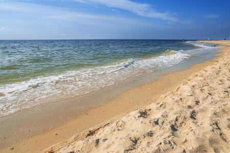 Sand beach with surf water background. The summer breeze.の写真素材