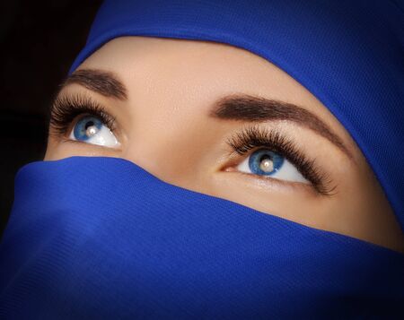 The eyes of a young beautiful eastern woman. Portrait of an oriental woman.の写真素材