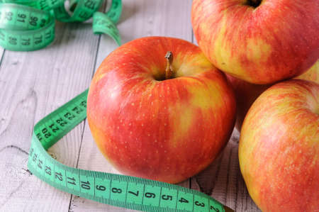 Fresh, ripe apples on an old wooden table. Fruit to comply with the diet.の写真素材