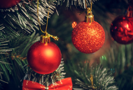 Christmas decorations on an artificial Christmas tree, a photograph in a vintage style.の写真素材