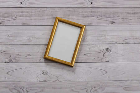 Frame for photography on a light, vintage wooden backgroundの写真素材
