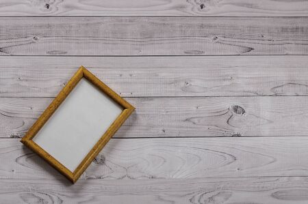 Frame for photography on a light, vintage wooden backgroundの写真素材