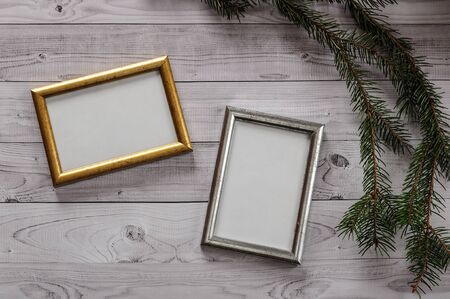 Two frames for photos on a light, vintage wooden background.の写真素材