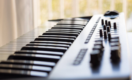 An electronic keyboard is set in a bright room. It has an 8 channel control board built in with...