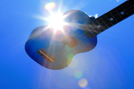 Classic guitar under blue sky