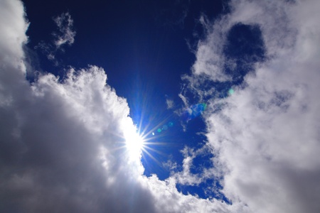 sunshine and white cloud under blue skyの写真素材