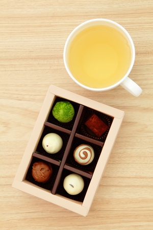 Delicious chocolate and hot green teaの写真素材