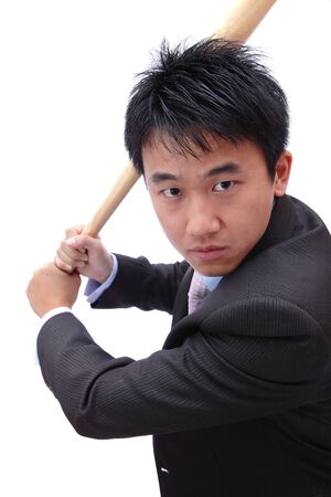 Business man hold baseball bat concentrate on hitの写真素材