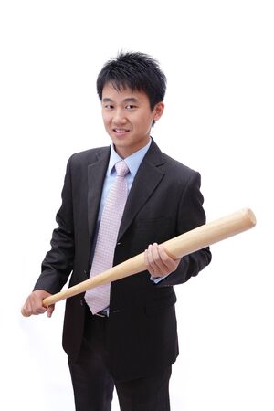 Business asian man take baseball bat with confident faceの写真素材