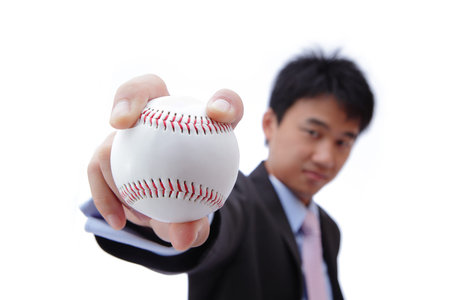 Business man take baseball with Self confident smile