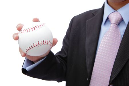Business man hand holding baseballの写真素材