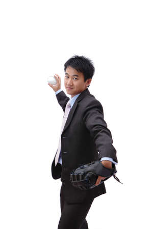 Young Business man pitching baseballの写真素材