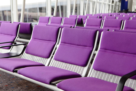 row of purple chair at airport in Hongkongの写真素材