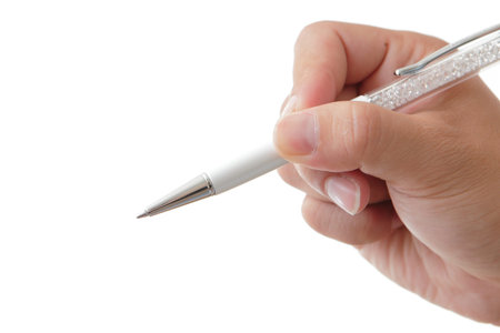Human hand with pen writing in the white background