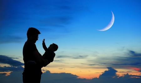 Silhouette of father and child on beautiful summer sunset with half crescent moon - familyの写真素材