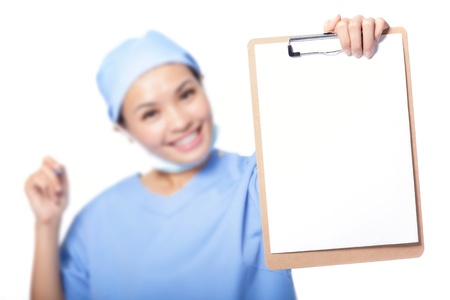 empty blank clipboard sign with copy space. Young woman doctor or nurse showing clipboard isolated over white background. asian female modelの写真素材