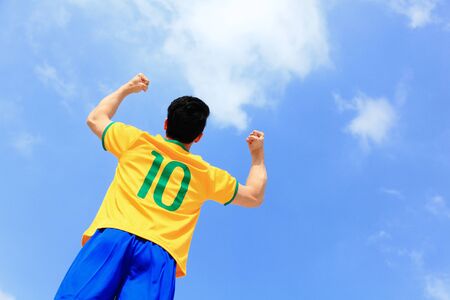 Excited brazil man with blue skyの写真素材